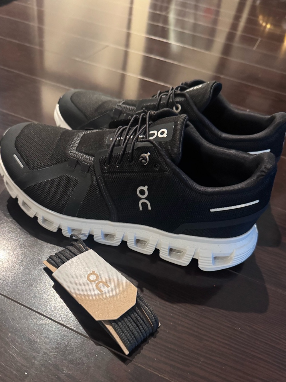 On Running women’s Cloud Sneakers in Black and White